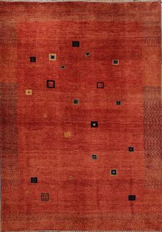 an orange and black rug with squares on it