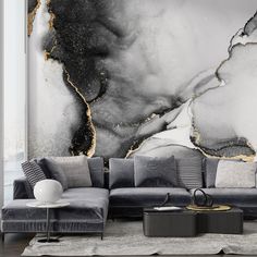 an elegant living room with black and white marble wallpaper, grey couches and large painting on the wall