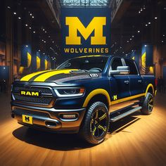 the ram truck is on display in front of wolverine's logo at an event