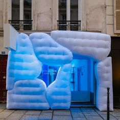 an inflatable entrance to a building with blue lights