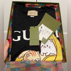 Purchased This T-Shirt At The Gucci Store Downtown Chicago, But Never Ended Up Using It. It’s Brand New With Tags And Also Included Is A Gucci Box. I Also Have The Exact Same One In Size Xl If Interested. Please Feel Free To Check Out My Other Listings. Gucci Designer Black T-shirt, Gucci Black Crew Neck Top, Gucci Black T-shirt With Logo Print, Designer Gucci Black T-shirt, Gucci Black Tops With Letter Print, Black Gucci Tops With Letter Print, Gucci Black Short Sleeve Tops, Black Gucci Short Sleeve T-shirt, Gucci Black Top With Letter Print