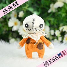 an orange stuffed animal with a white bow on it's head and the words sam written in black