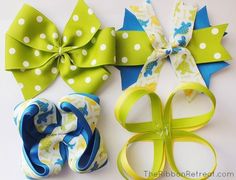 three bows with different patterns and colors are on a white surface, one is green, the other is blue