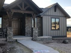 a house that is being built in the dirt