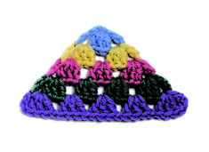 multicolored crocheted triangle on white background