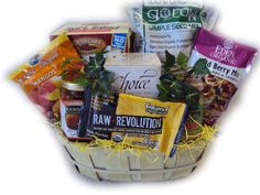 a basket filled with lots of different types of food and snacks on display in front of a white background