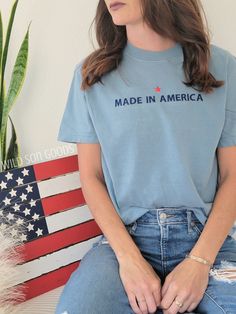 Great simple patriotic shirt to celebrate Independence Day or just to represent being American! Made in America tee with a small star above.  Pre shrunk and garment dyed, these shirts get softer as you wash and wear them and last a lifetime! These have a vintage look and a lived in feel! Choose from many t-shirt colors. If interested in adding embroidery to the sleeve please go to this listing: https://www.etsy.com/listing/1459929742/short-sleeve-embroidery-add-on?click_key=d1312efc779f6806021dc Vintage Patriotic, Sleeve Embroidery, Patriotic Tees, Patriotic Shirt, Vintage Usa, Patriotic Shirts, Team Usa, Made In America, Looks Vintage