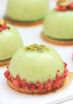 several desserts with green frosting and red sprinkles