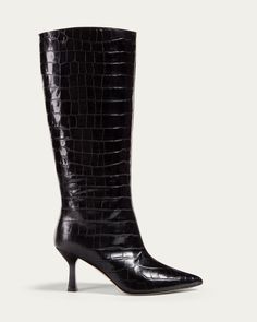 Croc print knee boot Made by hand in Italy A balance of timelessness and modernity. Versatile and elegant, with a classic pointed toe and elevated heel, Ana is the hero of every outfit and we know we'll be wearing them for many years to come. Description The hero of your Winter wardrobe, Ana is crafted in luxury Italian leather and set on a modern angled heel, with a flared base for extra comfort and stability. Featuring an elegant pull-on silhouette, elevated heel and a meticulous, minimal aest Bucket Boots, Aesthetic Boots, Girls Black Boots, Dear Frances, Dr Shoes, Icon Shoes, Knee High Heels, Croc Print, Minimal Aesthetic