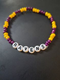 Ravens Football Beeded Bracelet.  football themed Avaliable in multiple colors, size. Diy Football Bracelets, Multicolor Team Spirit Beaded Bracelets For Game Day, Team Spirit Bracelets With Letter Beads, Multicolor Beaded Bracelets For Game Day, Adjustable Multicolor Beaded Bracelets For Game Day, Game Day Bracelets With Letter And Round Beads, Personalized Adjustable Beaded Bracelets For Football Season, Multicolor Beaded Bracelets For Team Spirit Gift, Multicolor Personalized Team Spirit Beaded Bracelets