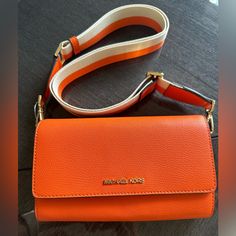 Michael Kors Xbody Leather Orange Natural Beauty And Soft Feel! New With Tag Travel Shoulder Bag With Branded Hardware In Orange, Orange Shoulder Bag With Branded Hardware For Travel, Orange Shoulder Bag With Branded Hardware For Everyday, Orange Soft Leather Crossbody Bag, Orange Crossbody Shoulder Bag With Detachable Strap, Modern Orange Crossbody Shoulder Bag, Michael Kors Handbags Orange, Michael Kors Leather Shoulder Bag For On-the-go, Orange Leather Shoulder Bag With Gold-tone Hardware