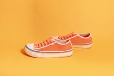 "Lovely bright orange & white Fila sneakers with bright orange laces, blue & orange stripes and white trim.  ➽ tag: Fila ➽ material: poly outer, man made material sole ➽ condition: good shape, has wear at sole and some staining at the fabric ➽ size: 6 ➽ measures: sole width 3 1/2\" / sole length 10\" / shoe height 3\" / heel height 1 1/2\" ➽ Apple Branches Vintage applebranchesvintage.etsy.com instagram.com/applebranchesvtg" White Fila Sneakers, Glitter Blouse, Fila Sneakers, Custom Bling, Black Leather Sneakers, Orange Glitter, Ruffle Bodysuit, Floral Dresses Long, Womens Tie