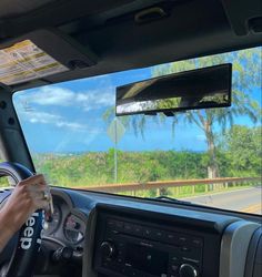 a man driving a truck down a road