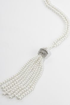 This sumptuous piece of jewelry features a retro-elegant yet slightly modern style that complements the lavish garments, reminiscent of the roaring 1920s. Features: Lustrous imitation pearls Delicate pearl tassels design High quality crystal 15 inch / 38cm long Elegant Tassel Necklace For Party, 1920 Accessories, Roaring 20s Jewelry, 20s Jewelry, Tassels Design, Pearl Tassels, Roaring 1920s, 1920s Jewelry, Your 20s