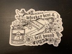 a sticker that says whiskey bent & we'll be bound with flowers on it