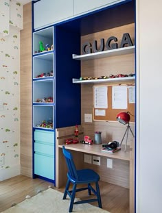 a child's desk and chair in the corner of a room