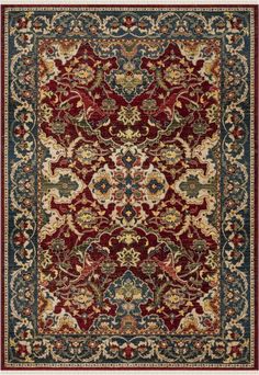 a red and blue rug with an ornate design on the bottom, in various colors