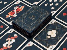 an art deco playing card box surrounded by other decked up cards and dices