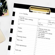 a black and white checklist on a clipboard next to a cup of coffee