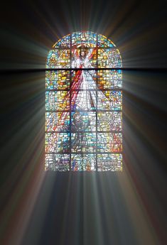 an image of a stained glass window with light coming through it