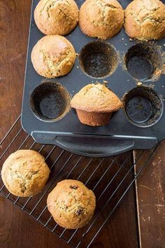 muffins cooling in the pan on a rack next to other muffins