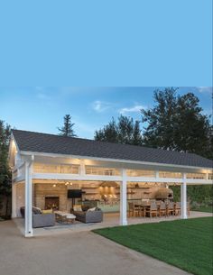 a covered patio area with furniture and lights