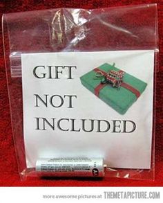 a gift not included sign is wrapped in plastic