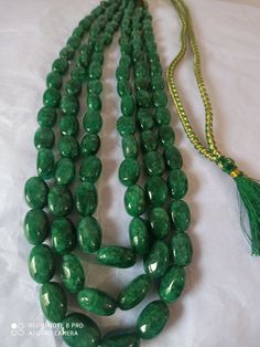 AAA 734 Carat Emerald beryl Oval Shape Fine Quality Smooth Beads With Adjustable Cord Necklace Stone : Emerald beryl Shape :- Oval Size :-6x8 - 12x17mm length - 18 inch, 3 line strings Weight :- 734 carat Polish :- Handmade color - green It is known as the 'love stone' as the message it emits is the strong vibration of unconditional love, joy, warmth and healing. As quartz crystals are profound amplifiers of energy, it may help to kindle happiness, love, romantic feelings and sensuality. It is g Oval Emerald Bead Necklace For Jewelry Making, Emerald Necklace With Oval Gemstone Beads For Jewelry Making, Oval Gemstone Beads Necklaces For Formal Occasions, Formal Oval Gemstone Beads Necklace, Formal Oval Gemstone Beads Necklaces, Formal Necklaces With Oval Gemstone Beads, Formal Oval Necklace With Polished Beads, Spiritual Oval Beaded Necklace With Gemstone Beads, Elegant Emerald Necklace With Oval Gemstone Beads