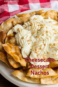 cheesecake dessert nachos on a white plate with red and white checkered table cloth