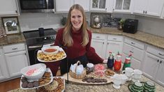 a woman sitting at a kitchen counter with food