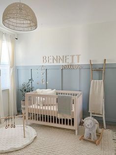 a baby's room with a crib, rocking horse and other items in it