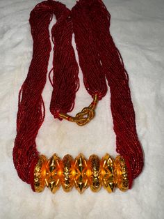 Nepali gold plated Chadke Tilhari. Chadke Tilhari is worn by Nepali married women's in any occasions or functions. Lightweight made of green and red pote goldplated jewelry