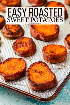 baked sweet potatoes on a baking sheet with text overlay that reads easy roasted sweet potatoes