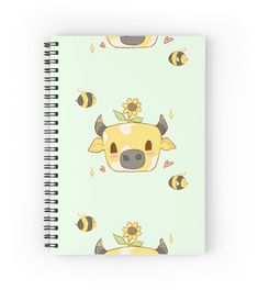 a spiral notebook with an image of a cow and sunflowers on the cover