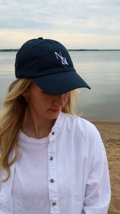 Stay cool and stylish this summer with our limited edition N & I Baseball Cap in navy. The adjustable sizing ensures a perfect fit, while the white embroidered logos on the front and back add a touch of sophistication. Upgrade your summer style with N & I. Summer Cotton Sports Hats, Sporty Cotton Hats For Summer Sports, Sporty Summer Cotton Hats For Sports, Sporty Summer Cotton Hats, Summer Sports Cotton Baseball Cap, Summer Cotton Baseball Cap For Sports, Cotton Summer Baseball Cap For Sports, Sporty Summer Baseball Cap With Curved Bill, Sporty Cotton Hats For Summer