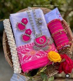 a basket filled with lots of different types of jewelry