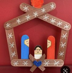 a nativity scene made out of wooden pegs