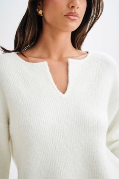 A warm embrace.The JENELLE Fluffy Oversized Jumper is the epitome of cozy chic. With its V neckline and open design, this jumper offers a relaxed and stylish look. The long sleeves and slouchy fit make it perfect for layering, providing both comfort and warmth. Crafted from a fluffy, unlined knit, the Jenelle Jumper is ideal for snuggling up in style during the colder months. Cozy Oversized Cropped Sweater With Ribbed Neckline, Oversized Cozy Cropped Sweater With Ribbed Neckline, Oversized Cropped Sweater With Ribbed Neckline, Cozy V-neck Top With Soft Texture, Cozy Cropped Sweater With Ribbed Neckline For Layering, White V-neck Sweater With Ribbed Neckline, Oversized Chic Sweater With Ribbed Neckline, Oversized V-neck Sweater With Soft Texture, V-neck Cropped Sweater For Layering