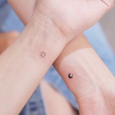 two wrist tattoos with the sun and moon on each one side, both showing their matching hands