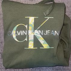 Calvin Klein Sweatshirt. Long. Size Medium. Never Worn. New Without Tags. Green Logo Print Sweatshirt For Spring, Casual Monogram Print Tops For Spring, Casual Tops With Monogram Print For Spring, Casual Spring Tops With Monogram Print, Calvin Klein Sweatshirt, Jeans Tops, Sweatshirt Dress, Womens Calvin Klein, Calvin Klein Jeans