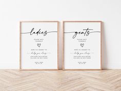 two framed wedding signs sitting on top of a wooden floor next to each other in front of a white wall