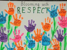 a child's handprinted poster with the words blooming with respect