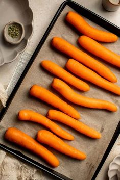 carrots on a baking sheet ready to be cooked in the oven for roasting