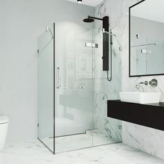 a bathroom with marble walls and flooring is pictured in this image, it has a glass shower door