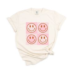 Looking for a cute versatile top to wear this summer? Make sure to grab one of our Pink Four Square Smiley Faces garment dyed graphic tees! This soft and comfortable graphic tee is the perfect top for any outfit. It can be paired with biker shorts, jeans, or even a simple skirt/dress! This tee is true-to-size, so be sure to order your regular t-shirt size! If you are looking for a more oversized look, make sure to size up! Trendy Bleached T-shirt With Relaxed Fit, Trendy Cream Summer T-shirt, Summer Tie Dye T-shirt With Funny Print, Acid Wash Organic Cotton Casual Tops, Casual Acid Wash Organic Cotton Tops, Trendy Bleached Cotton Tops, Summer Bleached Relaxed Fit T-shirt, Relaxed Fit Bleached T-shirt For Summer, Casual Soft-washed Cream Top