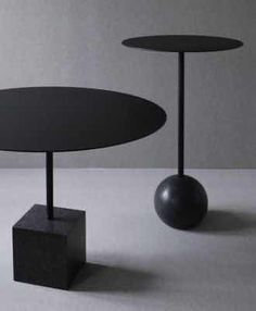 two black tables sitting next to each other