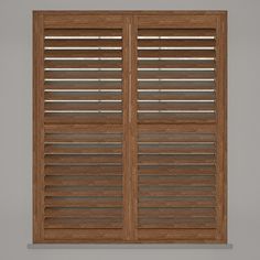 an open wooden shuttered window on a gray wall