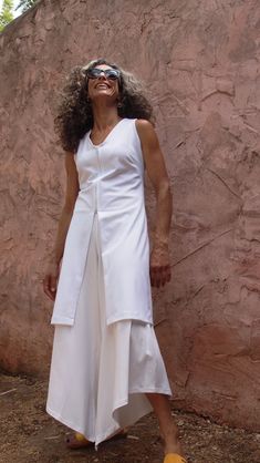 This is our loved vest in a tailored yet very lightweight fabric, in White. Complete your wardrobe with the White Knee Length Summer Vest for women, a Zipper Tunic Length Sleeveless Top, that will serve you every day and also on Special Occasions. It can be perfect as a Resort Summer Elegant Top. a Super flattering tunic/vest for all sizes. Details: * Closes with a zipper across the front. * Also available in maxi length- https://etsy.me/2ISGL6e * V neck tunic * Model is wearing size S * For a c Elegant Office Wear, Tunic Vest, Summer Tunic, V Neck Tunic, Sleeveless Tunic Tops, Summer Vest, Bridal Outfit, White Vest, Summer Tunics