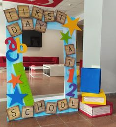 a mirror with letters and numbers on it in the shape of a school bus, which reads first day at school