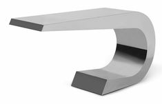 the modern table is made from stainless steel and has a curved base with an angled edge